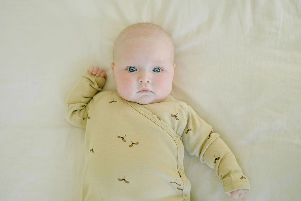Koalav long sleeve asymmetric snap front footed coverall seedlat