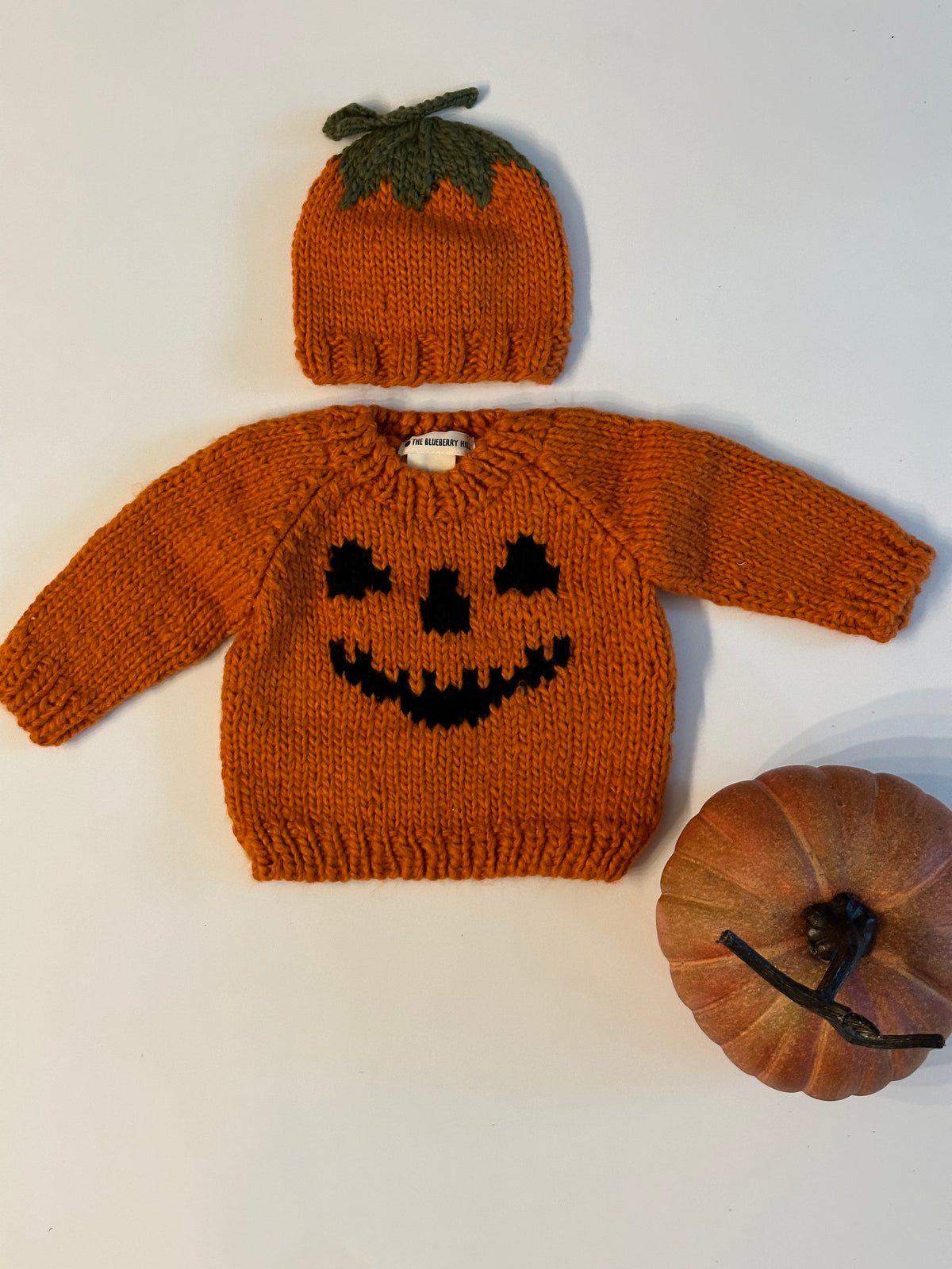 Hand knit cotton pumpkin sweater.