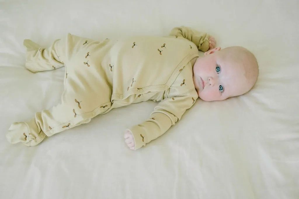 Koalav long sleeve asymmetric snap front footed coverall seedlat