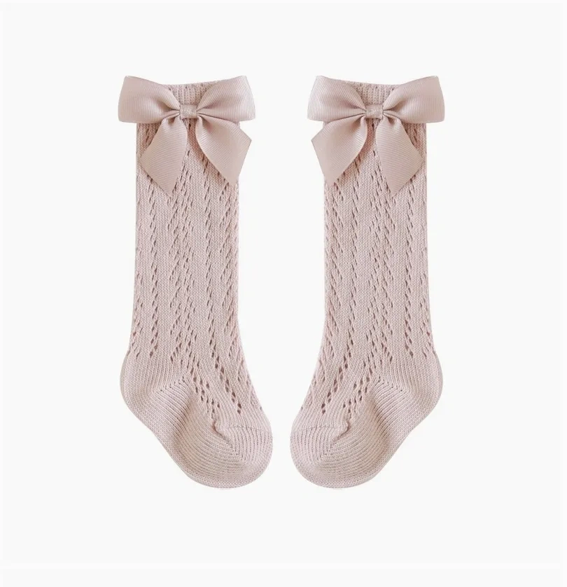 The Snug Baby Company crochet high sock with grossgrain bow